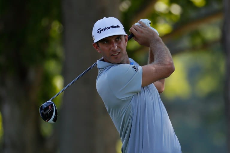 Dustin Johnson of the United States reacts to his tee shot during a practice round prior to the 2016 PGA Championship at Baltusrol Golf Club on July 27, 2016 in Springfield, New Jersey