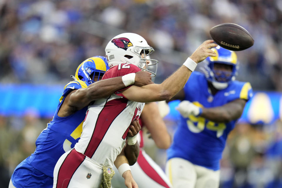 Arizona Cardinals quarterback Colt McCoy is hit by Los Angeles Rams linebacker Justin Hollins as he throws during the second half of an NFL football game Sunday, Nov. 13, 2022, in Inglewood, Calif. (AP Photo/Jae C. Hong)