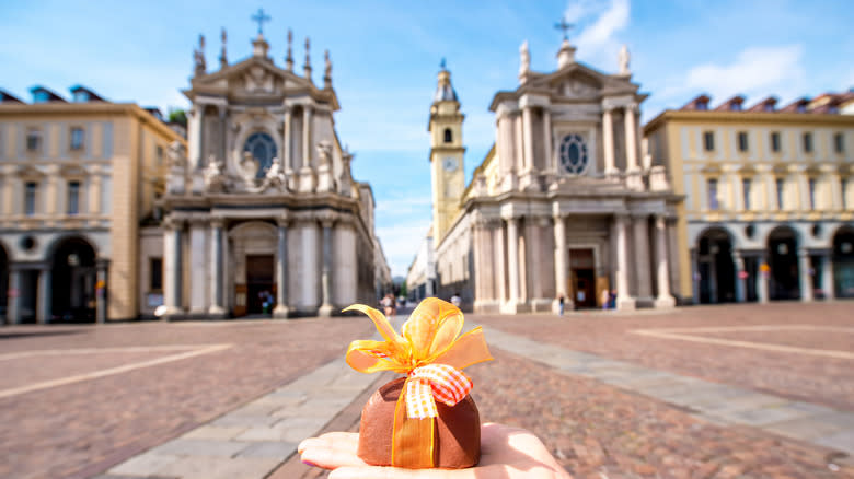 gianduiotti with a Turin square in background