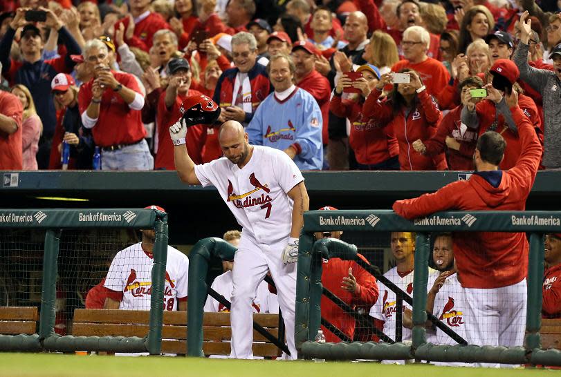 Cardinals' outfielder Matt Holliday obliges the fans with a curtain call after hitting a pinch-hit home run during a 7-0 with against the Pirates. (AP)