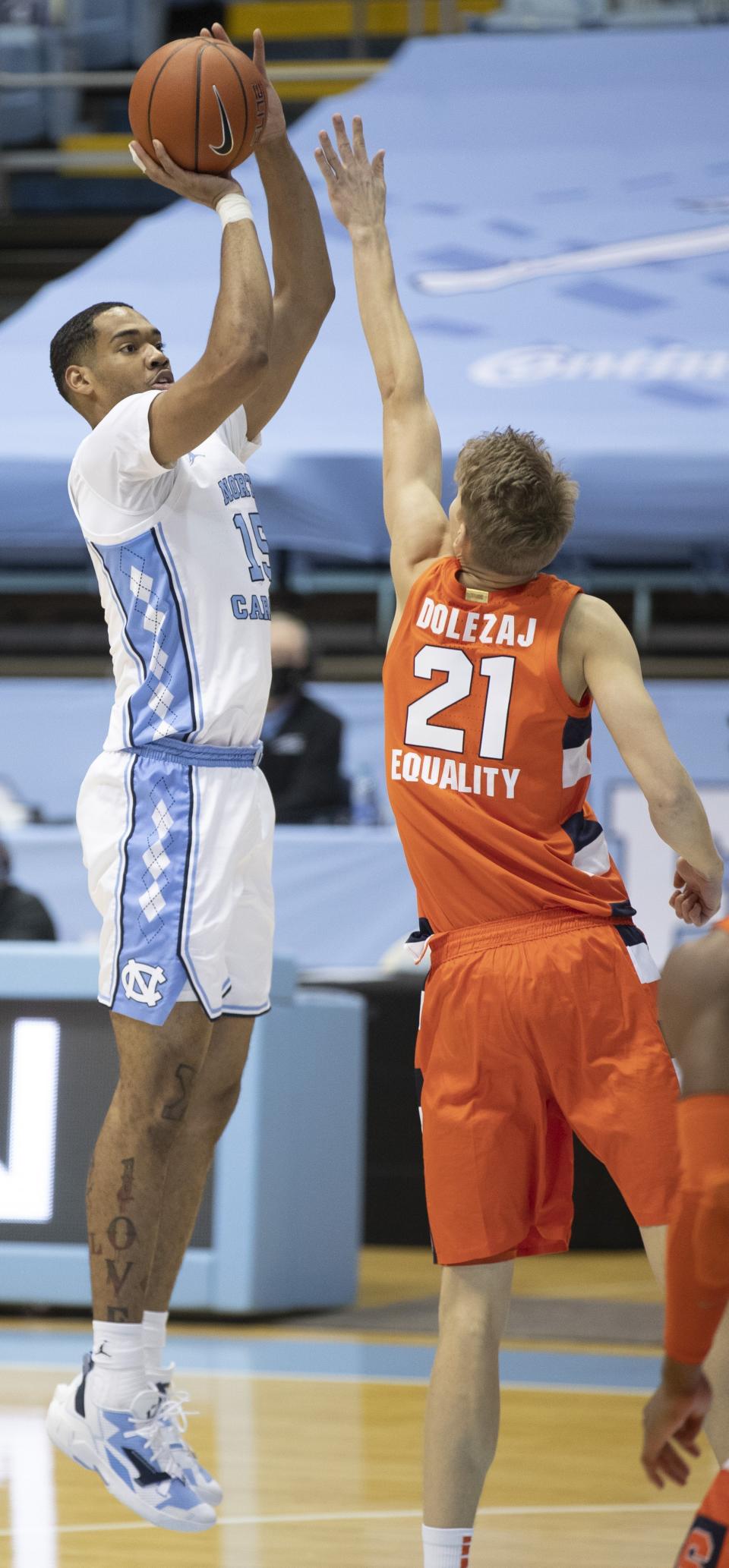 North Carolina's Garrison Brooks (15) shoots against Syracuse's Marek Dolezaj (21) during the first half of an NCAA college basketball game Tuesday, Jan. 12, 2021, in Chapel Hill, NC. (Robert Willett/The News & Observer via AP)