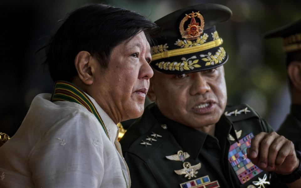 Philippine President Ferdinand Marcos Jr. (L), and Philippine Army Commanding General Romeo Brawner Jr. at Wednesday's ceremony - Ezra Acayan/Getty Images AsiaPac