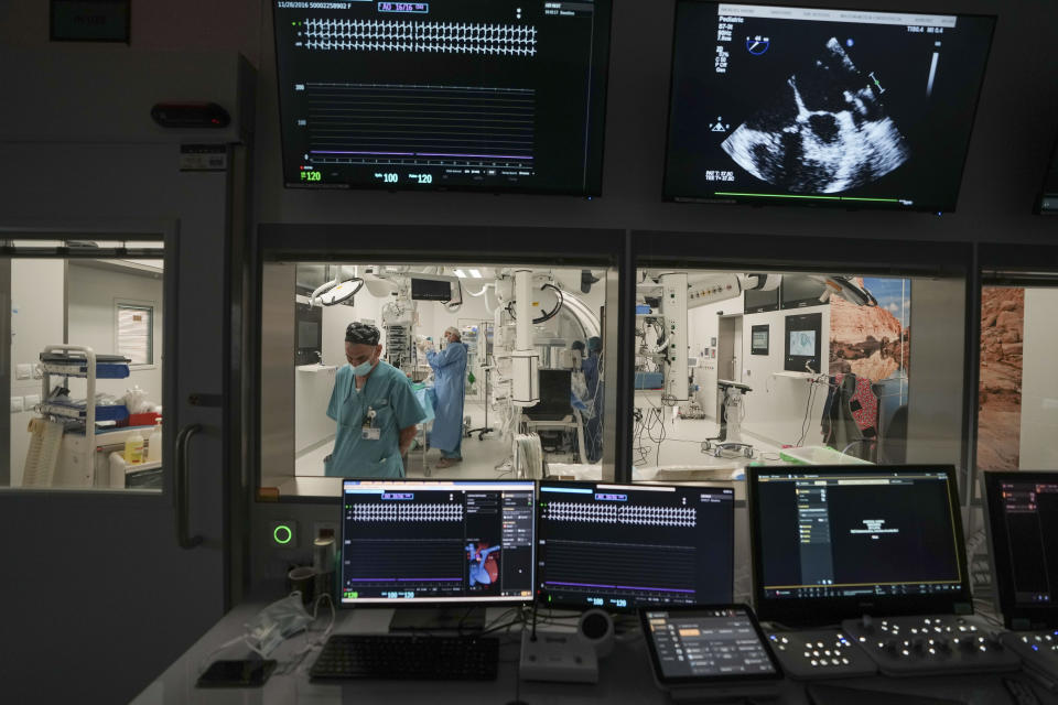 Computers monitor the vital data of Karina Andreiko, a 5-year-old Ukrainian girl, as she undergoes heart surgery by a team led by Dr. Sagi Assa, head of invasive pediatric cardiology, from the Save A Child's Heart non-profit organization, at the Wolfson Medical center in Holon, near Tel Aviv, Israel, Monday, May 2, 2022. Andreiko, received treatment in Israel for a heart defect that she would not have in her war-ravaged home country. (AP Photo/Ariel Schalit)