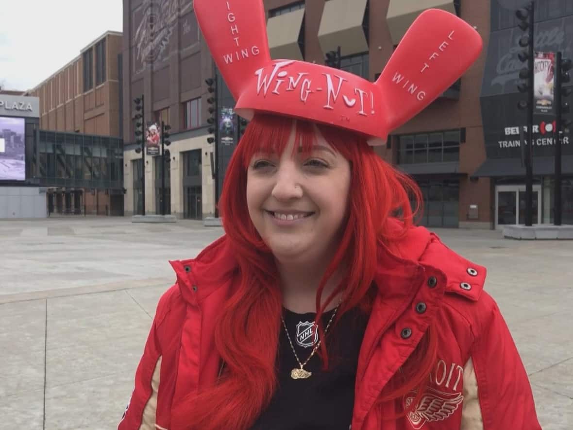 Heather Petrie, a Red Wings fan, made the trip to Detroit on Friday to watch the team play the Ottawa Senators. As of Friday, fully-vaccinated travellers coming to Canada no longer need to take a molecular or antigen COVID-19 test before entering the country. (Jennifer La Grassa/CBC - image credit)