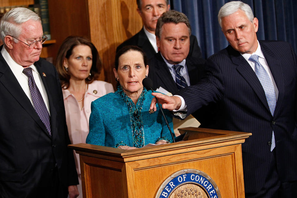 Mike Pence and other anti-abortion Republicans stand at a podium.