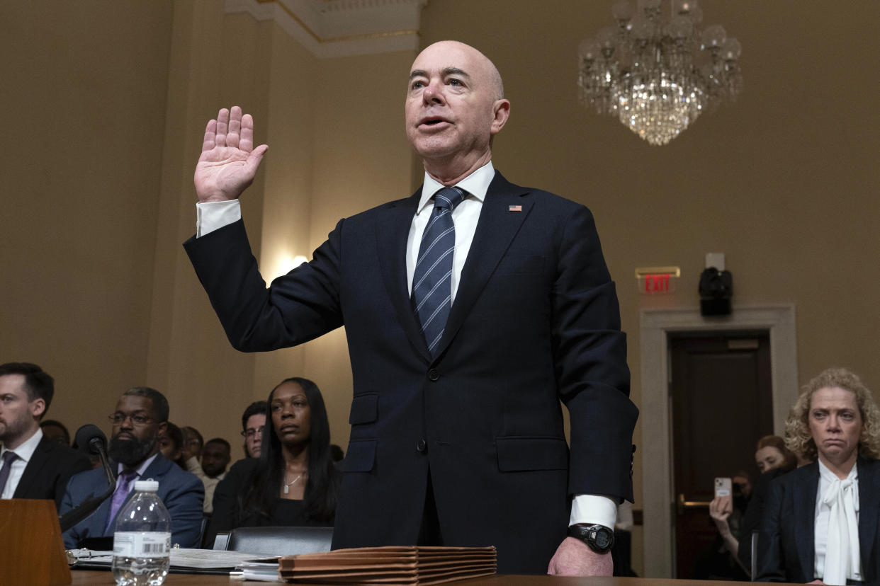 Homeland Security Secretary Alejandro Mayorkas is sworn in before a House hearing on Capitol Hill.