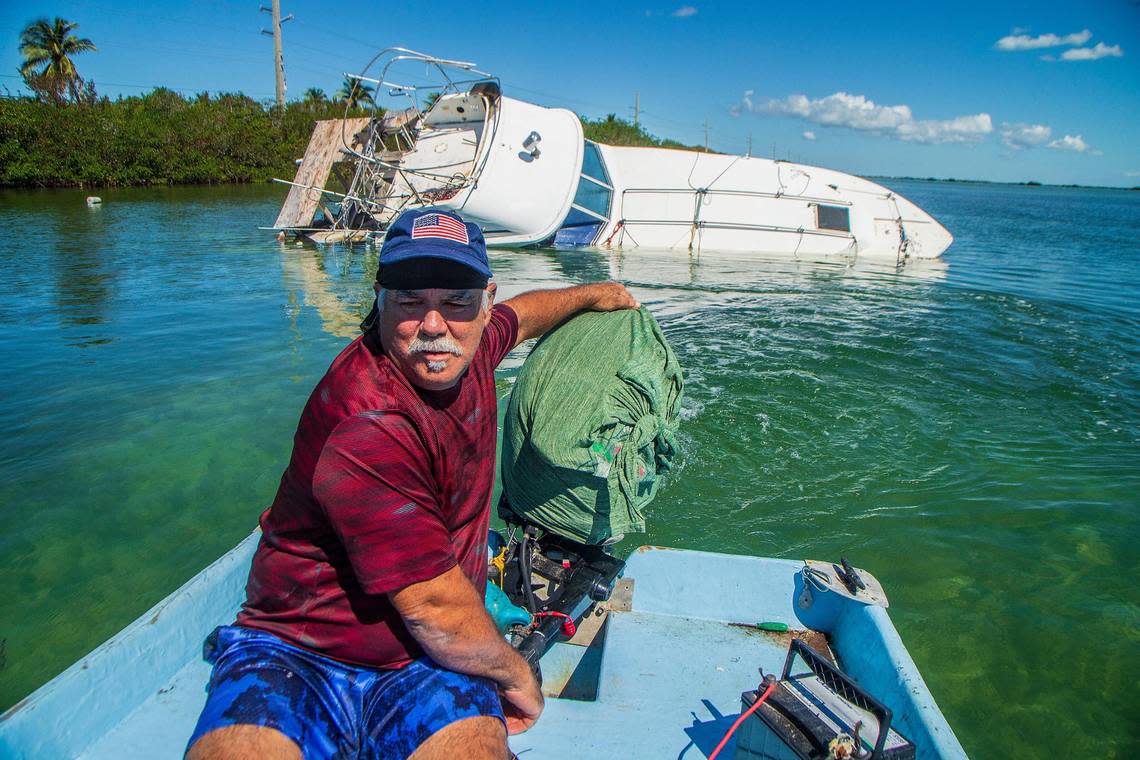 Fisherman Ernesto Hernandez navigates around his sunken boat off Sugarloaf Key Thursday, Oct. 27, 2022. His vessel sank in Hurricane Ian, which passed by the Florida Keys on Tuesday, Sept. 27, 2022, before hitting the Southwest coast the next day as a Category 4 storm. Pedro Portal/pportal@miamiherald.com