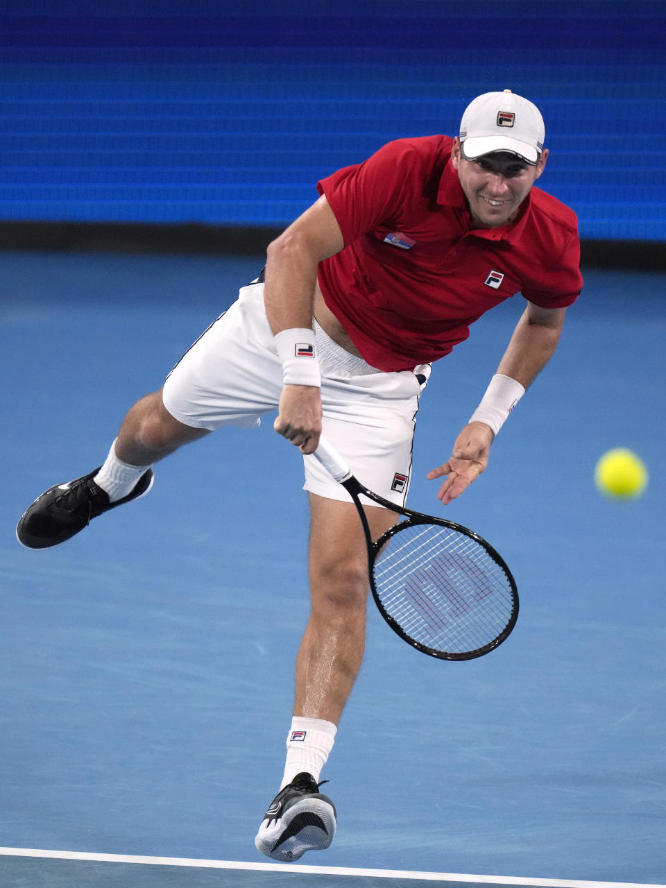 Serbia's Dusan Lajovic serves to Norway's Casper Ruud during their match at the ATP Cup tennis tournament in Sydney, Saturday, Jan. 1, 2022. (AP Photo/Rick Rycroft)