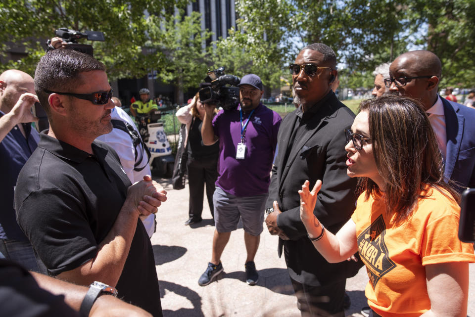 Will Haraway, an NRA supporter, argues with Alyssa Milano, founder of NoRA, during a protest against the National Rifle Association in Dallas on May 5. (Photo: AP Photo/Rex Curry)