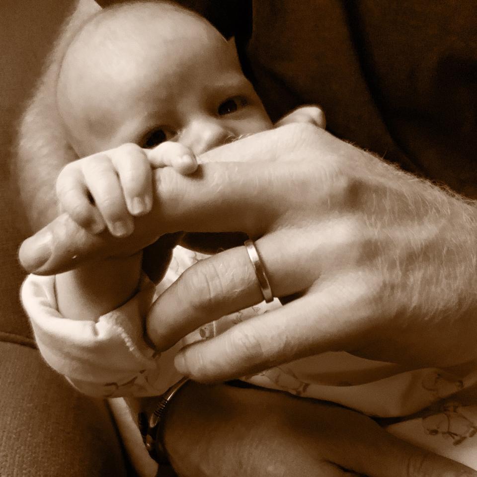 For Prince Harry's first Father's Day, the couple <a href="https://people.com/royals/prince-harry-first-fathers-day-new-photo-archie/" rel="nofollow noopener" target="_blank" data-ylk="slk:shared a new photo of the royal holding his son;elm:context_link;itc:0;sec:content-canvas" class="link ">shared a new photo of the royal holding his son</a>. Archie sweetly wraps his hand around one of Harry's fingers, peering at the camera from behind them.