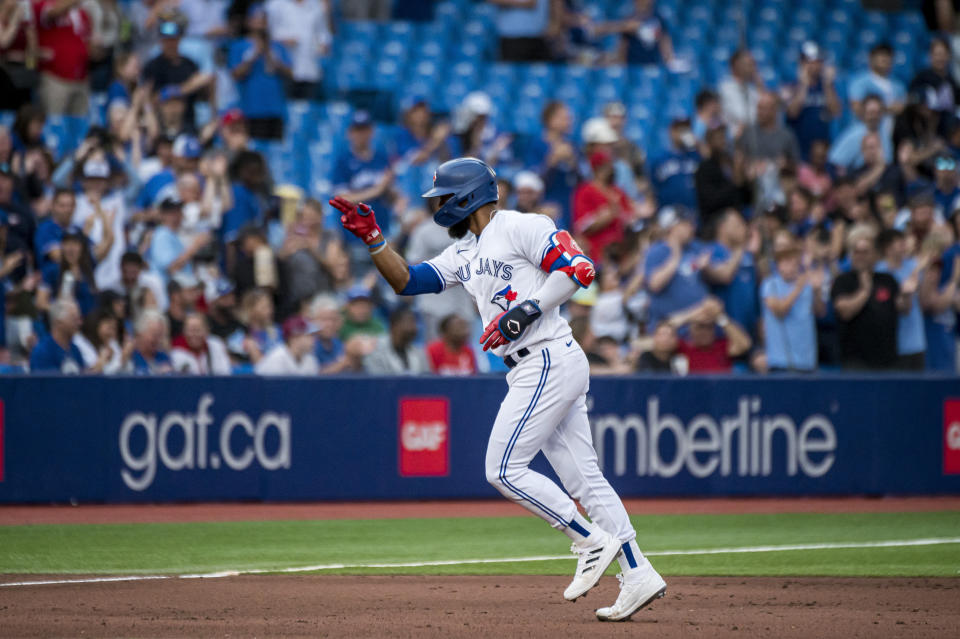 Toronto Blue Jays right fielder Teoscar Hernandez (37) celebrates after his home run against the Philadelphia Phillies during the fourth inning of a baseball game, Wednesday, July 13, 2022 in Toronto. (Christopher Katsarov/The Canadian Press via AP)