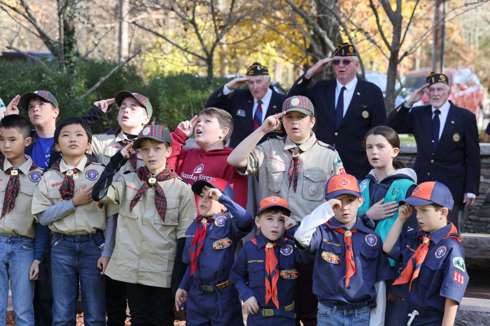 Members of Easton Boy Scouts of America Troop 193 and Easton VFW Post 2547 recite the Pledge of Allegiance at the Veterans Day ceremony at Veterans Memorial Park in Easton on Thursday, Nov. 11, 2021.