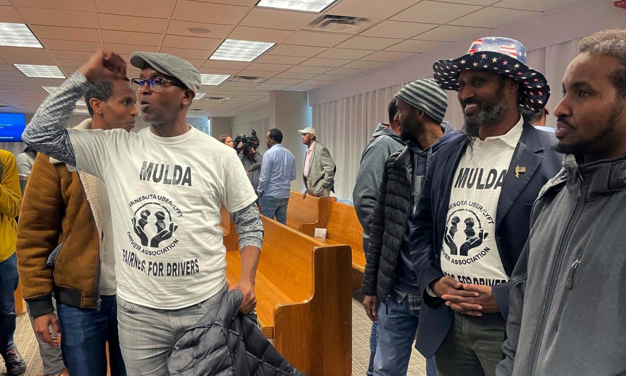 <span>Rideshare drivers celebrate in Minneapolis, Minnesota, on 7 March 2024, after city council voted to pass a measure that would increase wages.</span><span>Photograph: Trisha Ahmed/AP</span>