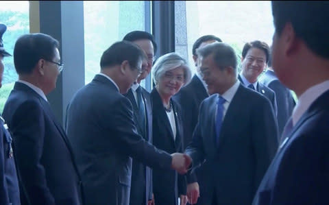 South Korean President Moon Jae-in arrives for the inter-Korean summit at the truce village of Panmunjom, in this still frame taken from video - Credit: Reuters