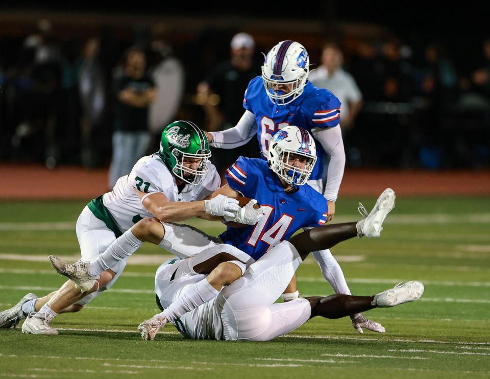 Cedar Park linebacker Reid Vines tackles Leander wide receiver Aidan Parker during their Oct. 27 game at Bible Stadium. The Timberwolves won 49-7.