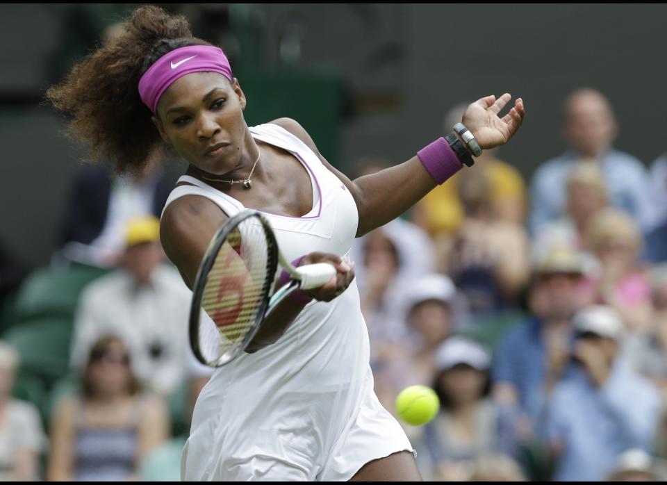 Serena Williams of the United States plays a shot to Victoria Azarenka of Belarus during a semifinals match at the All England Lawn Tennis Championships at Wimbledon, England, Thursday, July 5, 2012. 