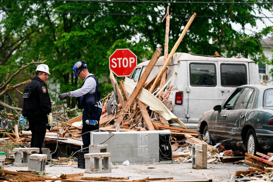 Investigators work the scene of a deadly explosion in a residential neighborhood in Pottstown, Pa., Friday, May 27, 2022. A house exploded northwest of Philadelphia, killing several people and leaving others injured, authorities said Friday. (AP Photo/Matt Rourke)