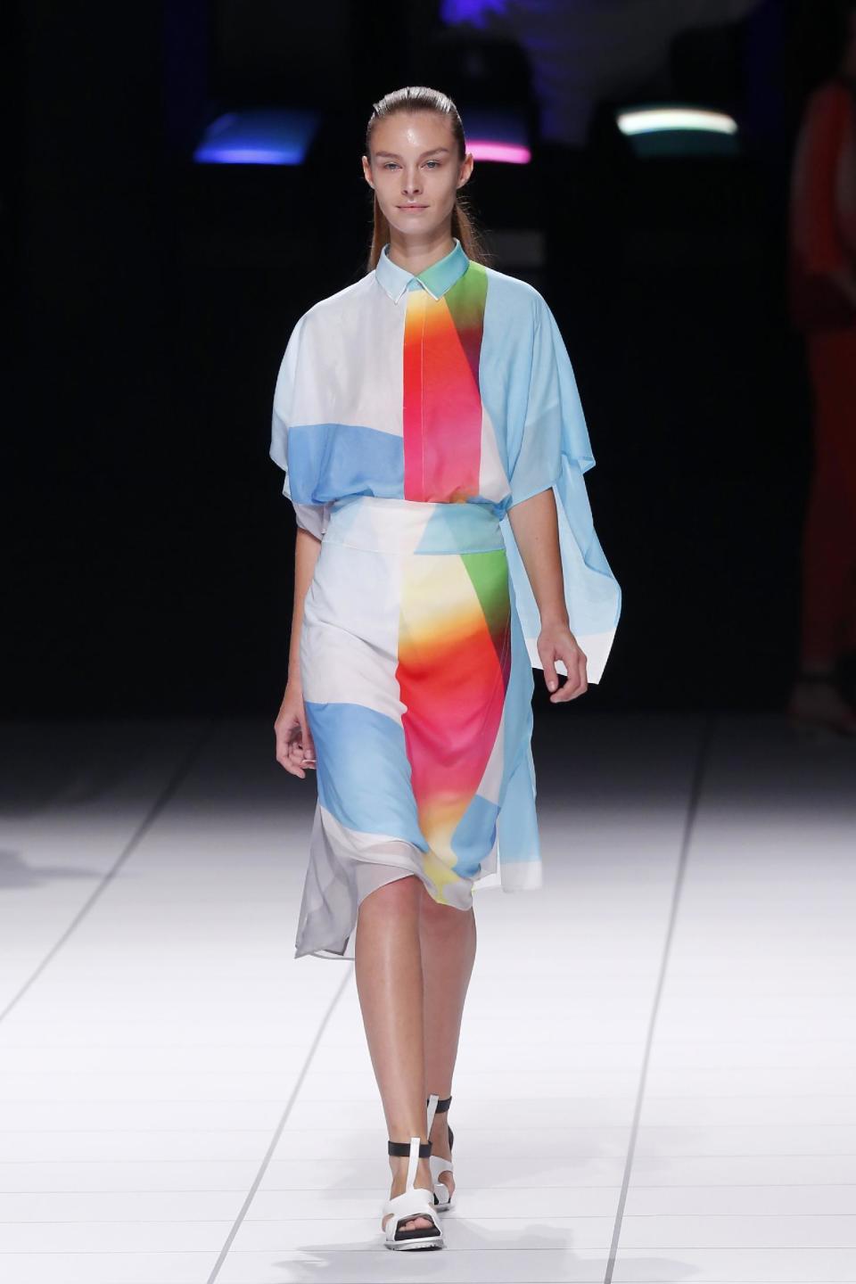 A model presents a creation as part of Issey Miyake's ready-to-wear Spring/Summer 2014 fashion collection, presented Friday, Sept. 27, 2013 in Paris. (AP Photo/Jacques Brinon)