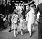 <p>The two young princesses walk with their mother (PA Archive) </p>