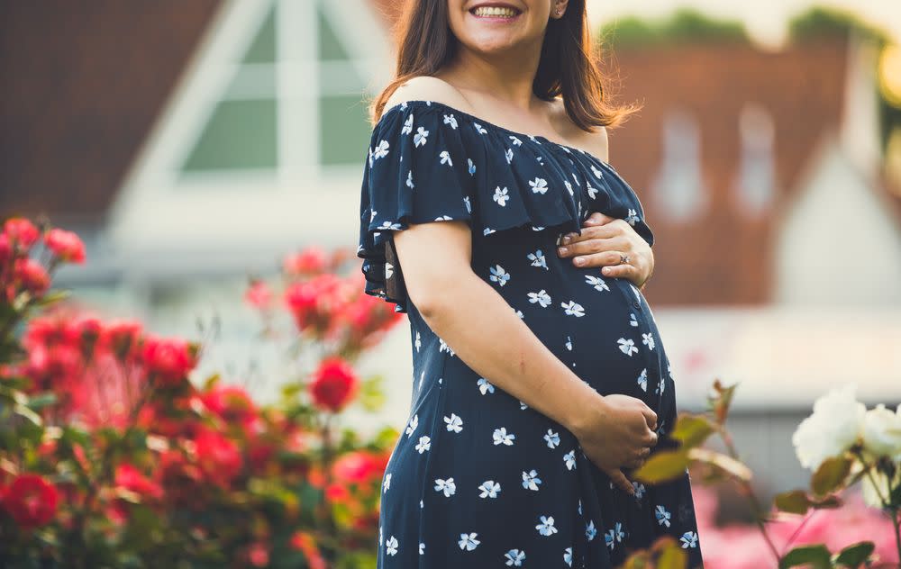 Pregnant Woman Wearing Maternity Dress