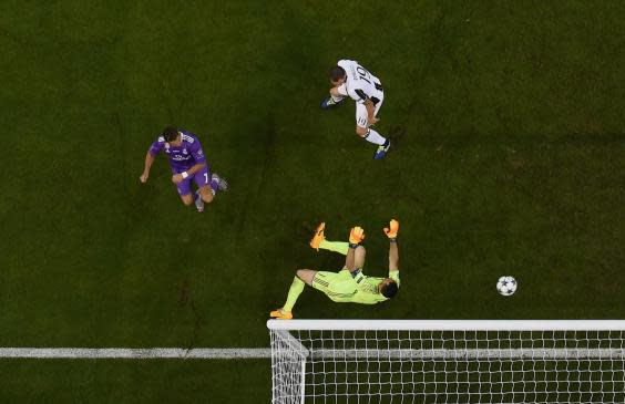 Ronaldo scores past Gianluigi Buffon in the Champions League final (Getty )