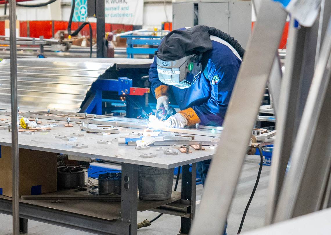 Workers put the Amtrak Airo train together piece by piece throughout the Siemens Mobility manufacturing facility in Sacramento, Wednesday, Oct. 11, 2023.