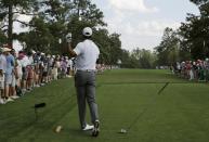 Tiger Woods of the U.S. drops his driver after hitting off the ninth tee and sending the ball onto the first fairway during first round play of the Masters golf tournament at the Augusta National Golf Course in Augusta, Georgia April 9, 2015. REUTERS/Mark Blinch