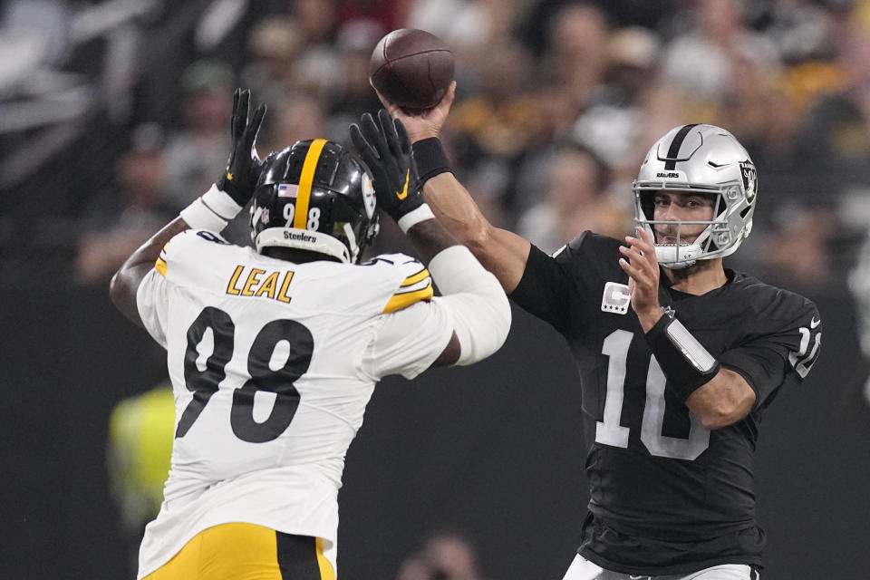 Las Vegas Raiders quarterback Jimmy Garoppolo (10) throws over Pittsburgh Steelers defensive end DeMarvin Leal during the first half of an NFL football game Sunday, Sept. 24, 2023, in Las Vegas. (AP Photo/Mark J. Terrill)