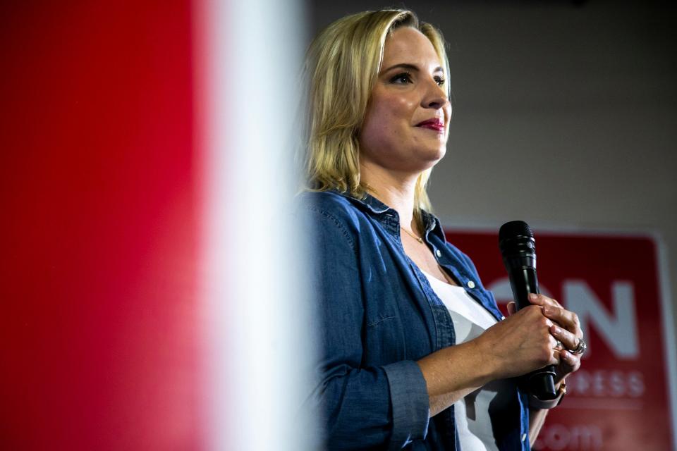 U.S. Rep. Ashley Hinson, R-Iowa, pauses while speaking during the a fundraiser.