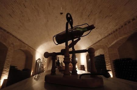 A wine bottle is seen on display in a cellar at the winery of Vassilis Panagiotou in the city of Markopoulo, east of Athens October 12, 2013. REUTERS/John Kolesidis