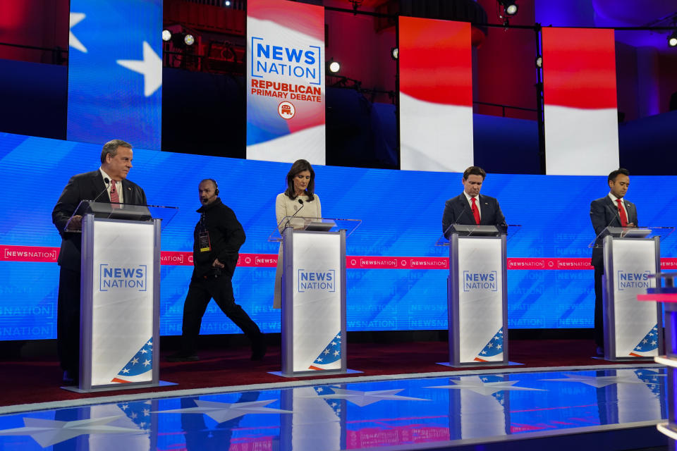 Republican presidential candidates former New Jersey Gov. Chris Christie, left, former U.N. Ambassador Nikki Haley, Florida Gov. Ron DeSantis and businessman Vivek Ramaswamy prepare before a Republican presidential primary debate hosted by NewsNation on Wednesday, Dec. 6, 2023, at the Moody Music Hall at the University of Alabama in Tuscaloosa, Ala. (AP Photo/Gerald Herbert)