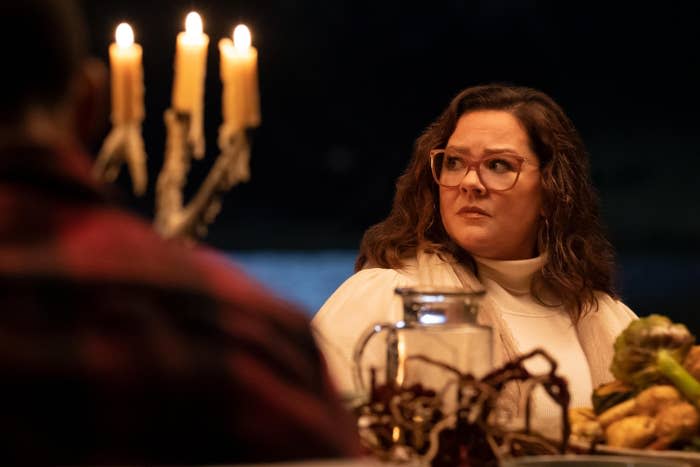 Melissa McCarthy sitting outside at a table