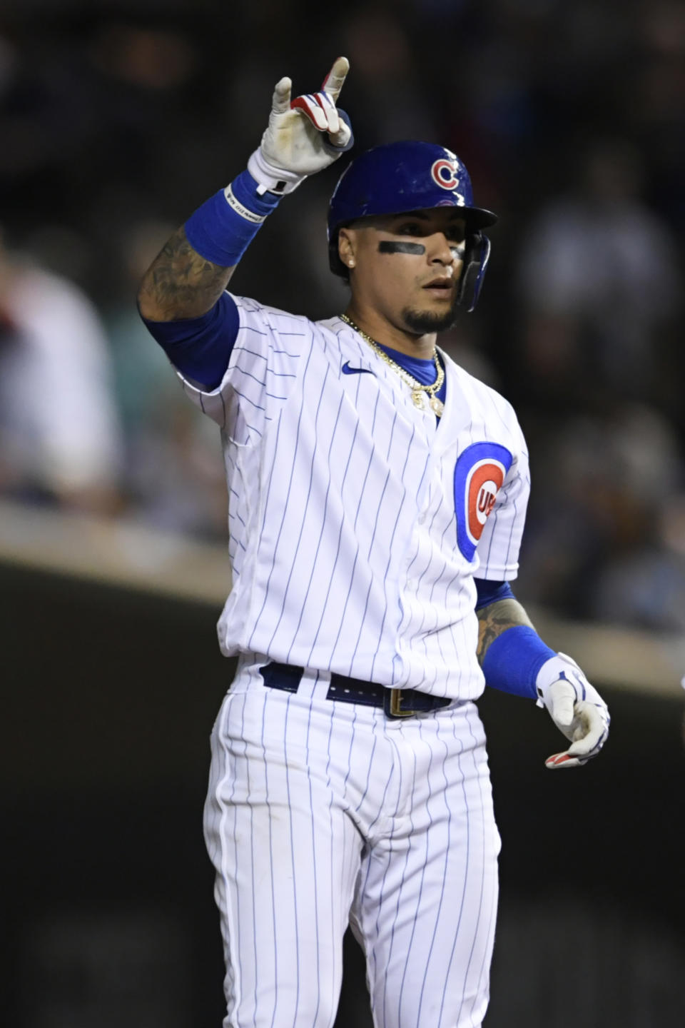 Chicago Cubs' Javier Baez celebrates at second base after hitting an RBI ground rule double during the sixth inning of a baseball game against the Cleveland Indians Tuesday, June 22, 2021, in Chicago. Chicago won 7-1. (AP Photo/Paul Beaty)