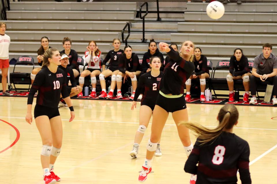 St. Andrew's junior setter Charlotte Glass defends a hard hit from Jupiter to keep the point alive for the Scots during a home game in Boca Raton on Oct. 11, 2023.