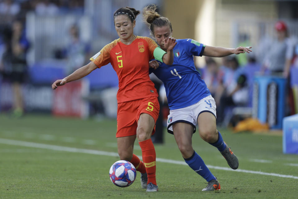 China's Wu Haiyan, left, vies for the ball with Italy's Aurora Galli during the Women's World Cup round of 16 soccer match between Italy and China at Stade de la Mosson in Montpellier, France, Tuesday, June 25, 2019. (AP Photo/Claude Paris)