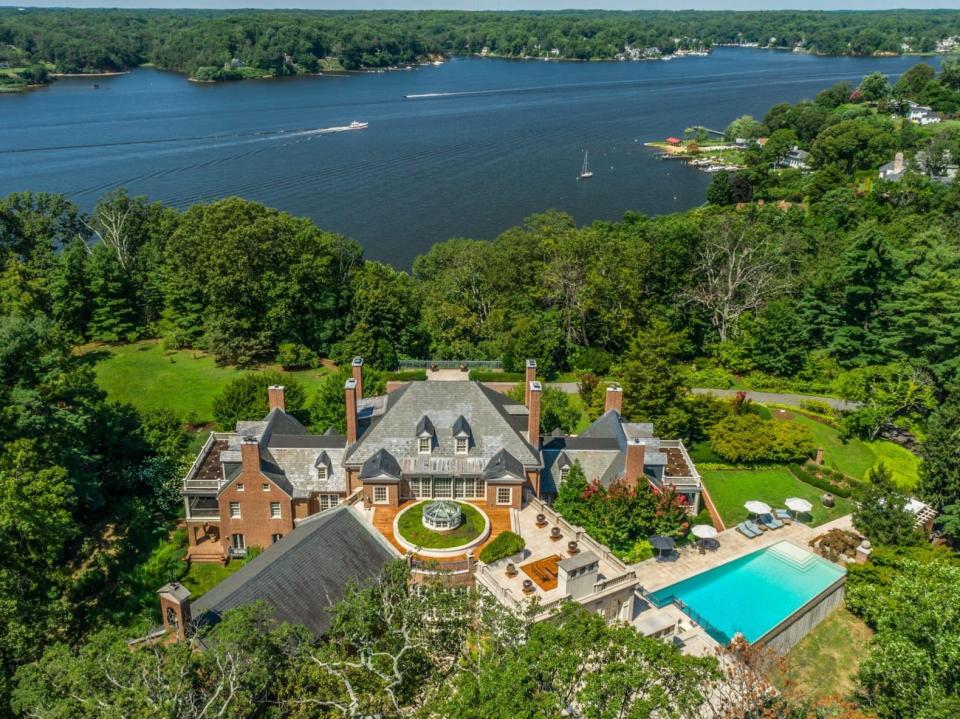 a mansion set among trees with the Severn River in the background in Maryland