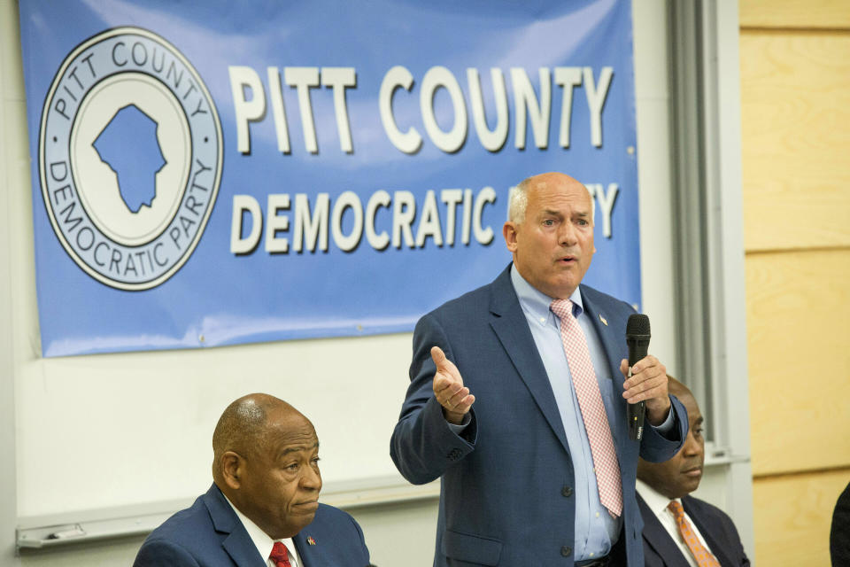 This photo taken Monday, April 15, 2019, shows Dana Outlaw speaking during the Pitt County Democratic Party forum in Winterville, N.C. U.S. Rep. Walter Jones Jr.'s long-held congressional seat in North Carolina was expected to be up for grabs soon, but it happened more quickly than most people anticipated. Months after the Republican announced his 2018 campaign would be his last, Jones' health faded. He died in February at age 76. Jones' death drew people from both sides of the aisle to praise his commitment to his constituents, his faith and his willingness to buck party leadership regardless of political consequences, such as when he opposed the Iraq War. It also drew more than two dozen candidates from four parties into an accelerated, off-year special election to replace him in the GOP-leaning 3rd Congressional District. (Juliette Cooke/The Daily Reflector via AP)