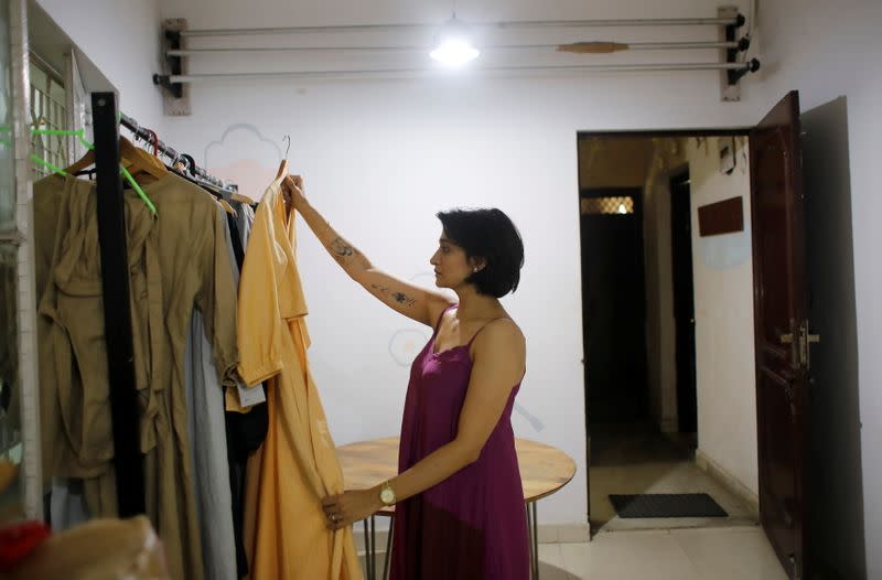 Kriti Tula, a fashion designer, checks clothes made from discarded fabric waste, at her factory in New Delhi