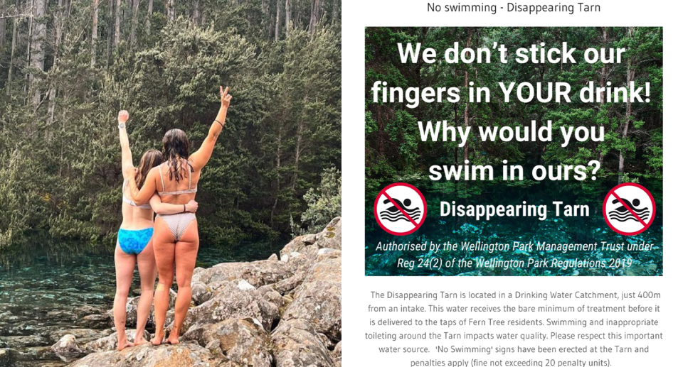 Two women swim in Disappearing Tarn next to a poster warning people away. 