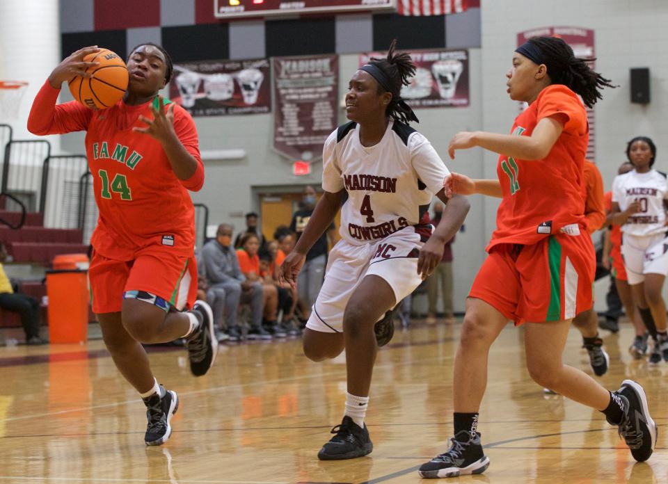 FAMU DRS senior forward Ameari Logan (14) steals the ball in a game against Madison County on Jan. 22, 2022, at Madison County High School. The Rattlers won 58-31.