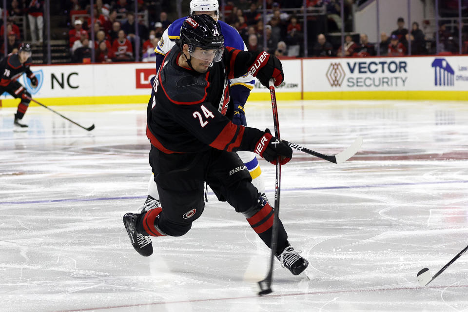 Carolina Hurricanes' Seth Jarvis (24) shoots the puck against the St. Louis Blues during the second period of an NHL hockey game in Raleigh, N.C., Saturday, Jan. 6, 2024. (AP Photo/Karl B DeBlaker)