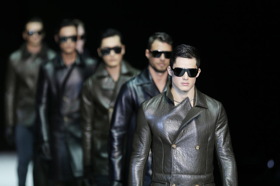 Models wear creations for Emporio Armani men's Fall-Winter 2013-14 collection, part of the Milan Fashion Week, unveiled in Milan, Italy, Monday, Jan. 14, 2013. (AP Photo/Antonio Calanni)