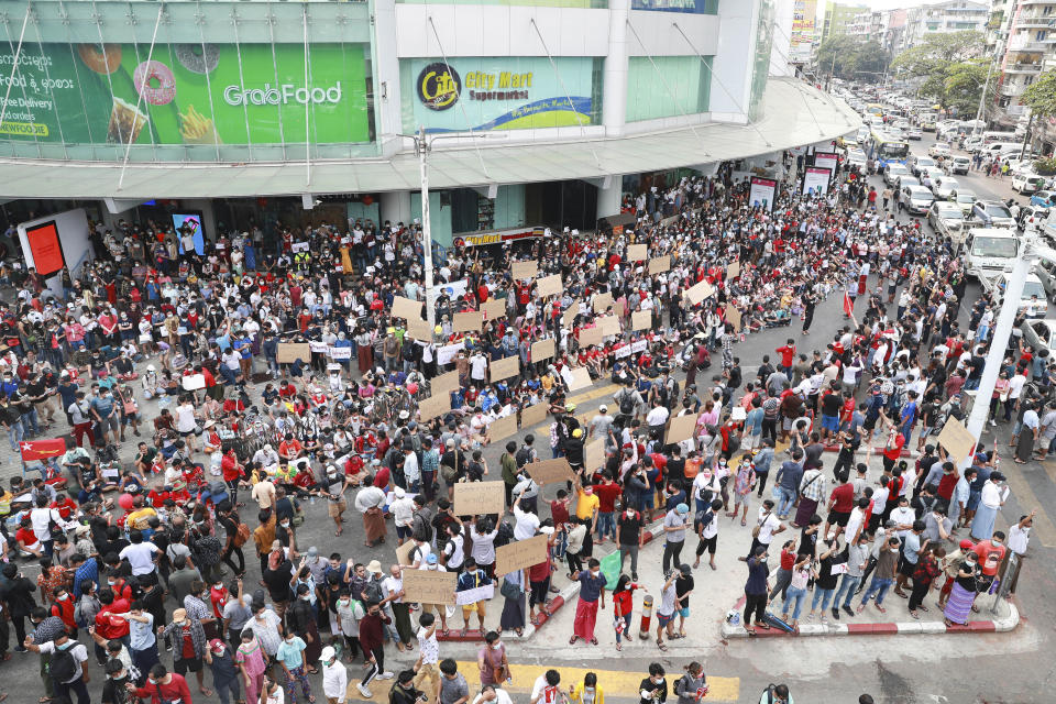Protesters gather outside the Hledan Center in Yangon, Myanmar, on Feb. 6, 2021. Protests in Myanmar against the military coup that removed Aung San Suu Kyi’s government from power have grown in recent days despite official efforts to make organizing them difficult or even illegal. (AP Photo)