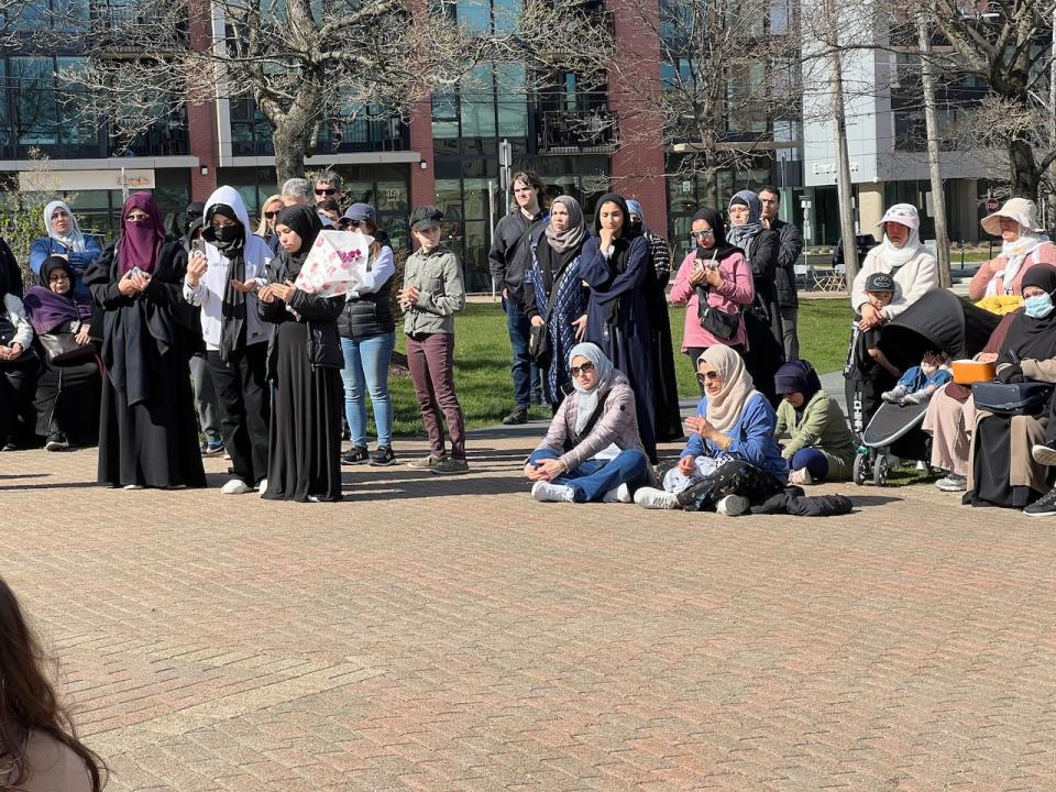 Those gathered to remember Ahmad Al Marrach prayed silently at the end of the event.