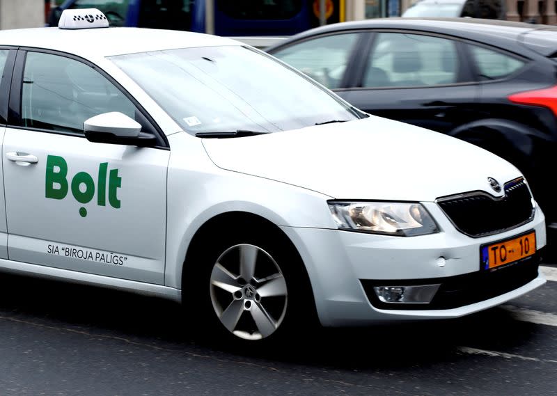 FILE PHOTO: A Bolt, formerly known as Taxify, sign is seen on the taxi car in Riga