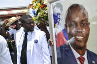 Jimmy Cherizier, alias Barbecue, a former police officer who heads a gang coalition known as "G9 Family and Allies," leads a march to demand justice for slain Haitian President Jovenel Moise in La Saline neighborhood of Port-au-Prince, Haiti, Monday, July 26, 2021. Moise was assassinated on July 7 at his home. (AP Photo/Matias Delacroix)