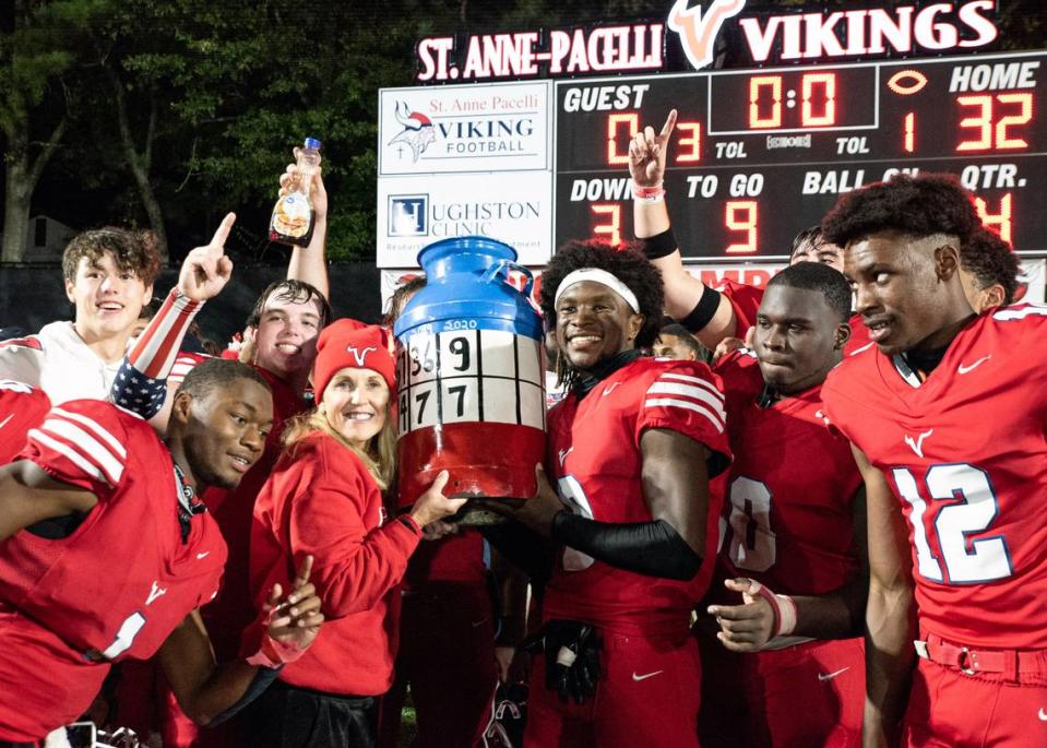 Ronie Collins, president of St. Anne-Pacelli Catholic School in Columbus, Georgia, poses for a photograph with players from Pacelli’s football team after they defeated rival Brookstone in 2021 to claim the Broochelli Jug. Collins has recently announced her retirement. 02/28/2024 Marc Spano/Photo courtesy of St. Anne-Pacelli Catholic School