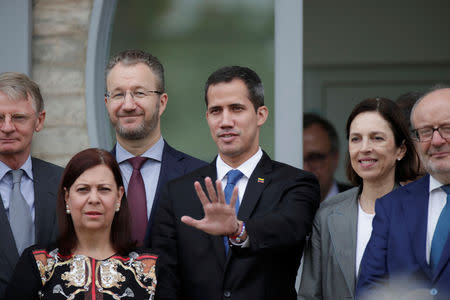 Venezuelan opposition leader Juan Guaido poses for a photo after a meeting at the European Union headquarters in Brasilia, Brazil February 28, 2019. REUTERS/Ueslei Marcelino