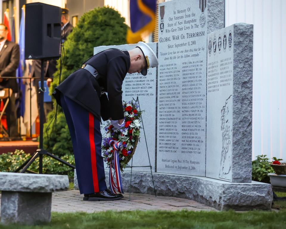 Anthony Martino places a wreath during Sunday's American Legion Post 35 Global War On Terrorism Monument rededication Sept. 11, 2022 in Hampton.