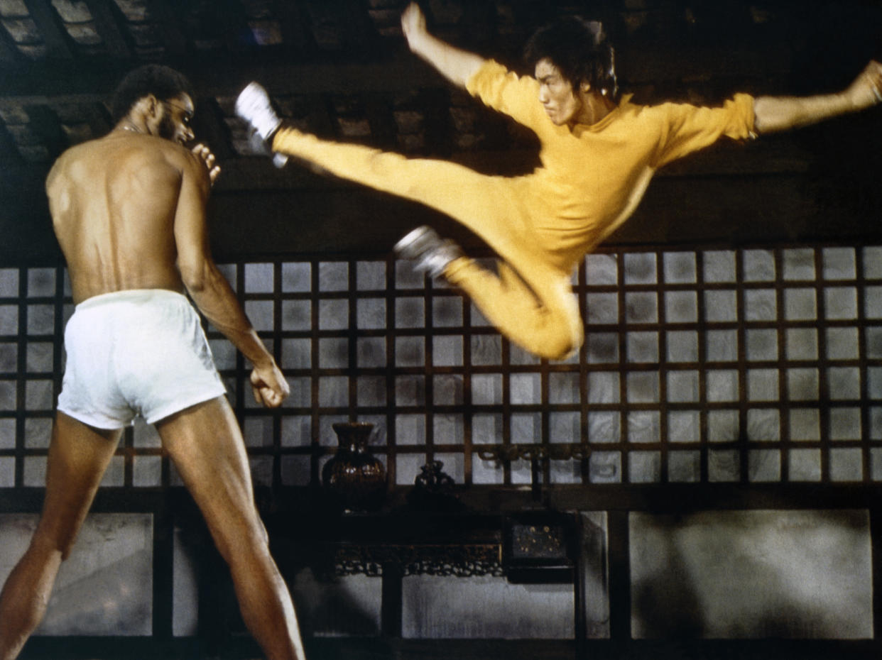 American actor Kareem Abdul-Jabbar and Chinese American martial artist and actor Bruce Lee on the set of Game of Death, written and directed by Robert Clouse. (Photo by Concord Productions Inc./Golden Harvest Company/Sunset Boulevard/Corbis via Getty Images)